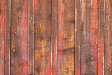 Red and yellow textured primitive or reclaimed wood planks for wooden background