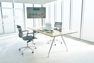 office room with business supply for meeting and television screen with morning sunlight