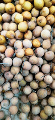 A collection of longan fruit that is ready to be sold to the market