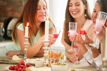 Cheers to Friendship: Girls Night In with Wine Glasses Raised High