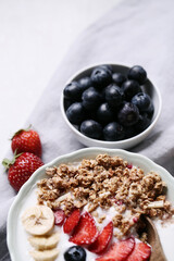 Healthy breakfast set on grey background. The concept of delicious and healthy food.