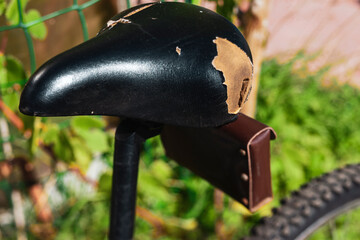 torn bicycle leather seat