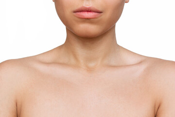 Cropped shot of a young woman with tender collarbone isolated on a white background. Body care, cosmetology. Soft delicate skin