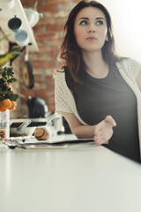 Woman posing on camera in the kitchen for social media