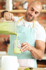 Healthy Habits in the Kitchen: Fitness Man Cooks Up a Delicious and Nutritious Salad and Milkshake