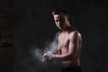 Sculpted to Perfection: Male Model Showcases His Fit Physique in a Studio Photoshoot