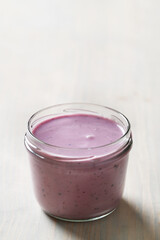 Homemade cooked healthy granola for breakfast in a wooden bowl on the table and near a bottle of milk. Place for text. Fitness food, snack