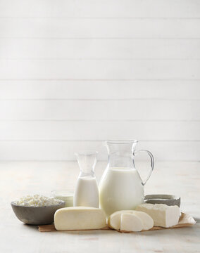 Homemade cooked healthy milk products for breakfast in a wooden bowl on the table and near a bottle of milk. Place for text. Fitness food, snack