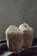 AI Generated Prompt

two glasses of hot chocolate with whipped cream and sprinkles, milkshake, drink milkshakes together, whipped cream, whipped cream on top, vanilla smoothie explosion, hot cocoa dri