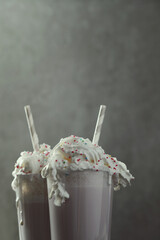AI Generated Prompt

two glasses of hot chocolate with whipped cream and sprinkles, milkshake,...