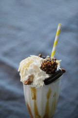 a milkshake topped with whipped cream and nuts, dessert, milkshake, caramel, gourmet, !!award-winning