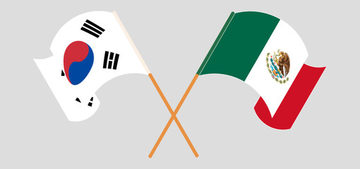 Crossed and waving flags of South Korea and Mexico. Vector illustration
