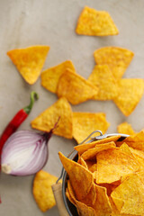 Spicy Guacamole With Tortilla Chips and Fresh Ingredients on a Table