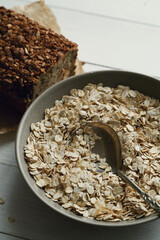 Whole grain bread with oatmeal flakes in bowl