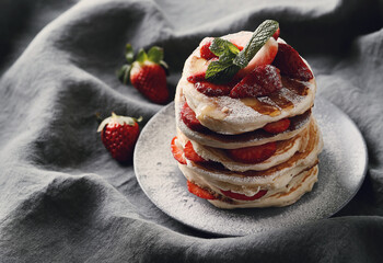 Healthy summer breakfast with classic pancakes with fresh fruits and honey in a plate