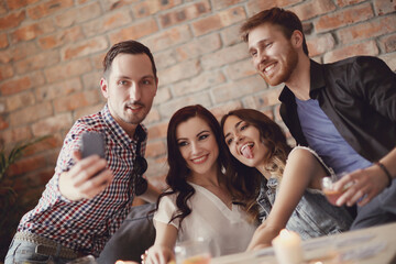 Company of friends make selfies for memory 