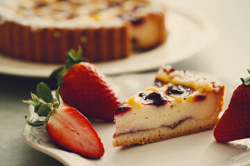 A piece of fresh tasty pie with berries on the plate