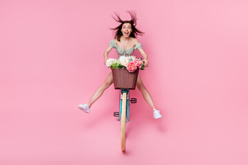 Full size photo of hooray lady ride bicycle wear printed dress shoes isolated on pink color background