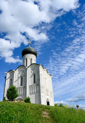 View of the church of Pokrova-na-Nerli, year 1165, on a hill in Bogolyubovo, Russia