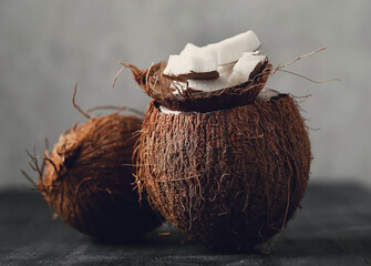 Fresh tasty juicy coconut on a dark background