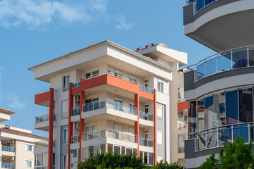 The exterior of an apartment building against the sky.