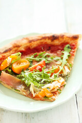 Photo of delicious hot sliced pizza with vegetables on a wooden background