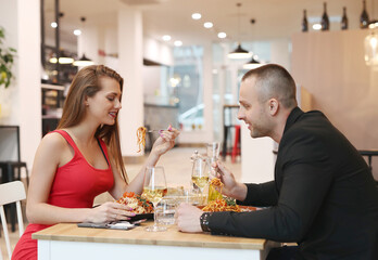Young couple sitting in a restaurant for a romantic dinner