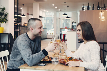 Young couple sitting in a restaurant for a romantic dinner
