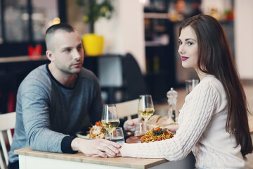 Young couple sitting in a restaurant for a romantic dinner