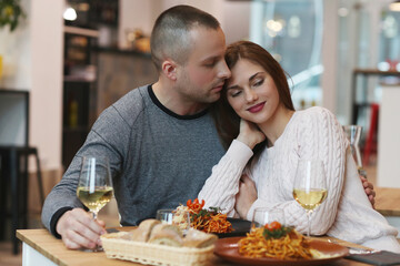 Beautiful young couple spending time together in a restaurant for a romantic dinner