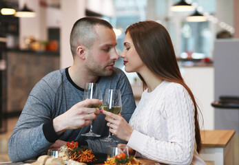 Beautiful young couple spending time together in a restaurant for a romantic dinner