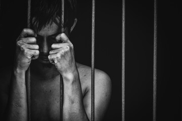 man crime in gaol, hold hand iron bar jail, punishment convict in justice law, cage for lock freedom, concept for stress, violence
