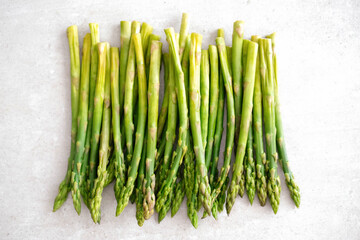 Fresh tasty green asparagus on a light background
