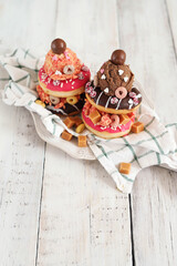 Top view of delicious sweet donuts with ice cream on top of the plate