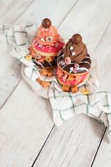 Top view of delicious sweet donuts with ice cream on top of the plate