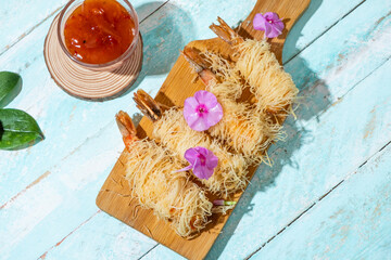 Appetizer of shrimp wrapped in kataifi dough, top view.