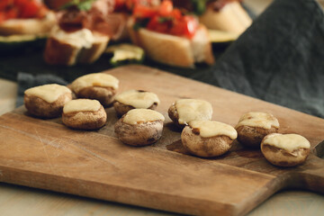 Delicious grilled mushroom snacks with cheese for the holiday table