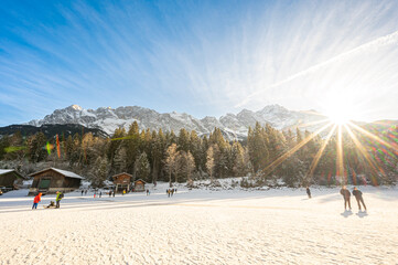 sunny landscape of Zugspitze, the top of germany, from frozen eibsee lake