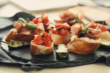 Delicious snacks in the form of mini sandwiches with meat and vegetables for the party