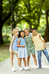 Group of asian and caucasian kids having fun in the park