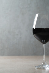 Side view photo of one glass of red wine 