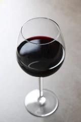 Fotobehang Top view photo of one glass of red wine  © racool_studio