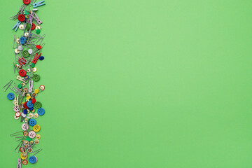 Top view of different stationeries isolated on a green background