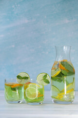 cold citrus lemonade with ice, lemon, mint, lime and orange