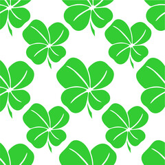seamless symmetrical pattern of green quatrefoil clover on a white background, texture, design