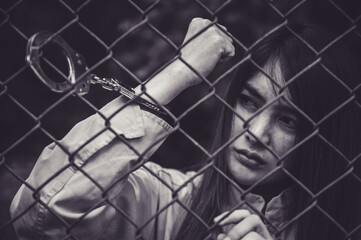 Portrait of women desperate to catch the iron prison,prisoner concept,thailand people,Hope to be...