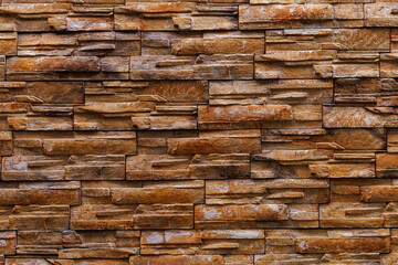 Textured rough surface of decorative natural stone wall. Background or backdrop. A blank for design