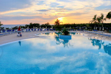 End of the summer season for bathing establishments and resorts. Pool at sunset, no people, no...