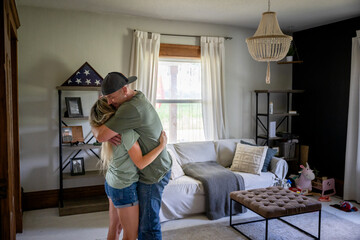 Marine veteran at home sharing a moment with wife.