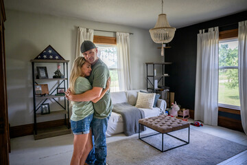 Marine veteran at home sharing a moment with wife.